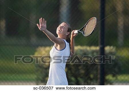 Stock Photo - Tennis player serving. Fotosearch