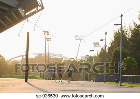 Tennis players walking outside stadium View Large Photo Image Stock Image - Tennis players walking outside stadium. Fotosearch