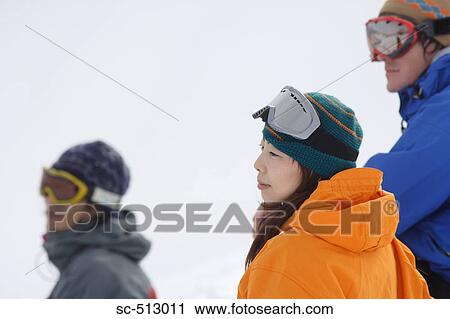 Stock Image - Three snowboarders. Fotosearch