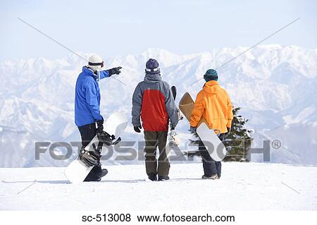 Three snowboarders View Large Photo Image Stock Photo - Three snowboarders . Fotosearch