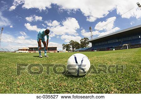 Stock Photo - Tired soccer player. Fotosearch