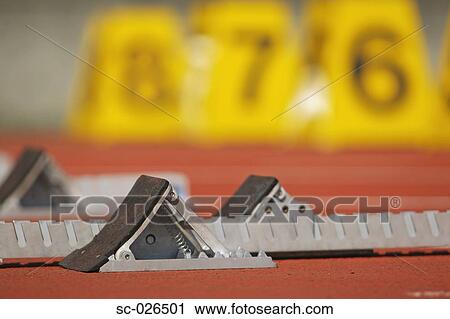 Track and field starting blocks at starting line View Large Photo Image Stock Image - Track and field starting blocks at starting line. Fotosearch
