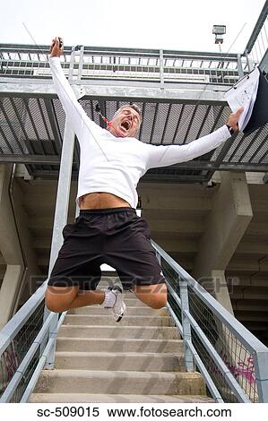 Trainer leaping victoriously View Large Photo Image Stock Photography - Trainer leaping victoriously. Fotosearch