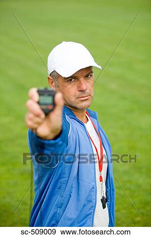 Trainer with timer View Large Photo Image Stock Photo - Trainer with timer. Fotosearch