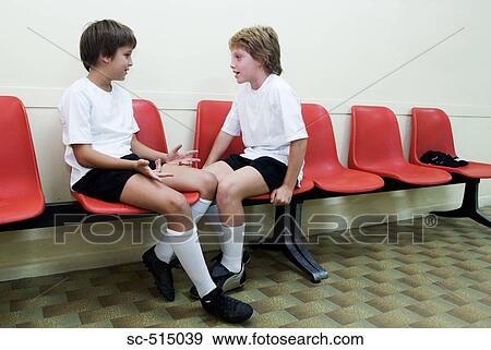 Stock Photo - Two boys having a post-game discussion. Fotosearch