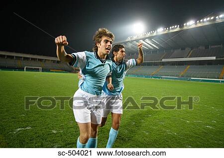 Two Soccer Players Celebrating View Large Photo Image Stock Image - Two Soccer Players Celebrating. Fotosearch