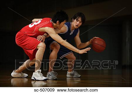 Two young Asian basketball players on court View Large Photo Image Stock Photo - Two young Asian basketball players on court. Fotosearch