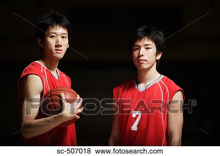 Stock Photo - Two young Asian basketball players. Fotosearch