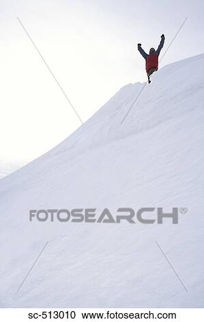 Stock Image - Victorious snowboarder. Fotosearch