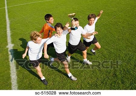 Victors taking home a trophy View Large Photo Image Stock Photo - Victors taking home a trophy. Fotosearch