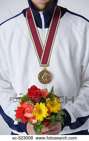 Winner Holding Bouquet View Large Photo Image Stock Photo - Winner Holding Bouquet. Fotosearch