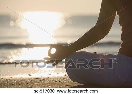 Woman Meditating On the Beach View Large Photo Image Stock Image - Woman Meditating On the Beach. Fotosearch