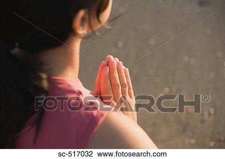 Stock Image - Woman Meditating. Fotosearch