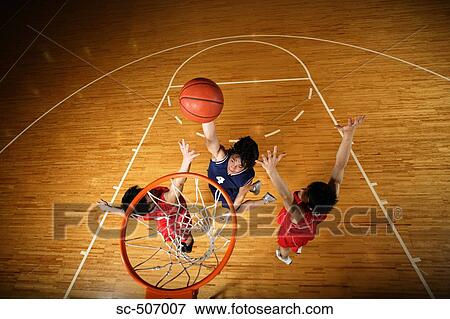 Stock Photo - Young Asian basketball players on court. Fotosearch