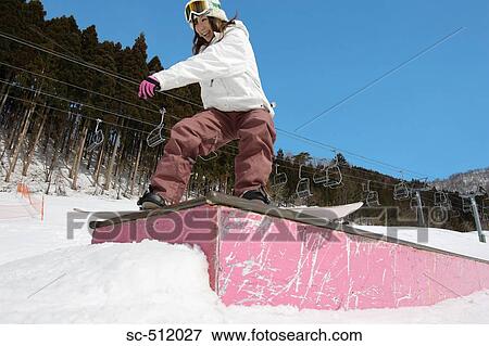 Young Asian female snowboarder View Large Photo Image Stock Photo - Young Asian female snowboarder. Fotosearch