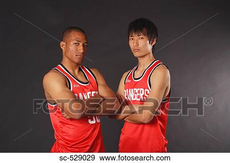 Young basketball players standing View Large Photo Image Stock Photo - Young basketball players standing. Fotosearch