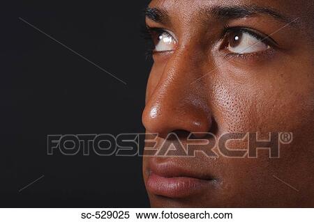 Young Japanese man looking away from camera View Large Photo Image Stock Photography - Young Japanese man looking away from camera. Fotosearch