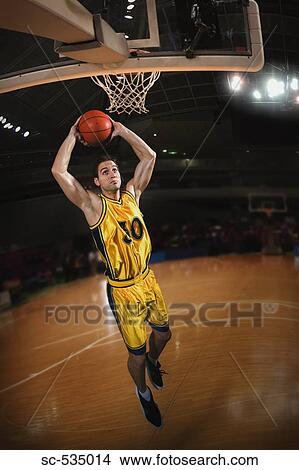 Young man preparing to throw basketball View Large Photo Image Picture - Young man preparing to throw basketball. Fotosearch