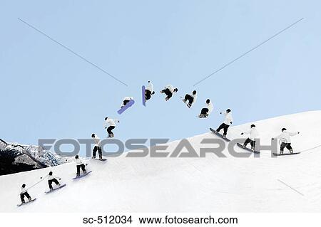 Picture - Young snowboarder airborne. Fotosearch