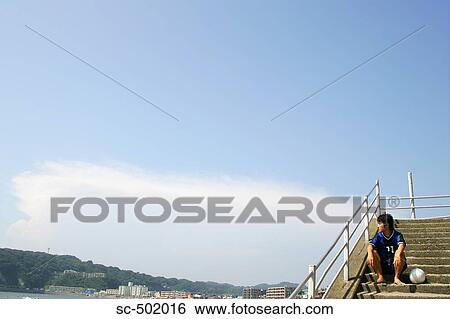 Young Soccer Player Sitting On a Flight of Stairs View Large Photo Image Stock Photograph - Young Soccer Player Sitting On a Flight of Stairs. Fotosearch