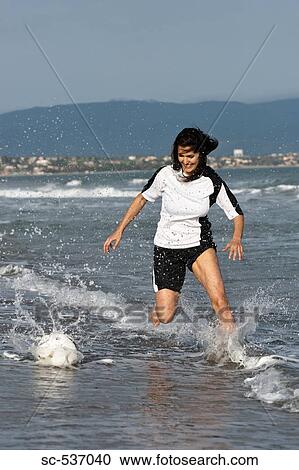 Young woman playing soccer View Large Photo Image Stock Image - Young woman playing soccer. Fotosearch