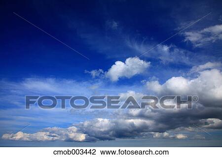 Stock Image - Blue sky with clouds. Fotosearch