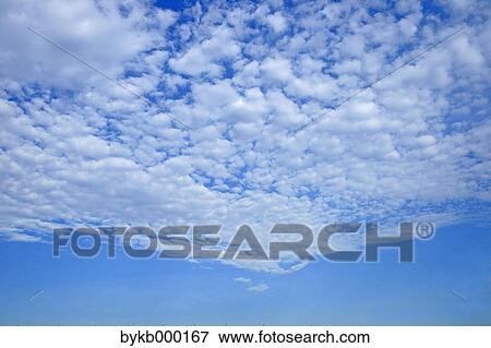 Blue sky with clouds View Large Photo Image Stock Photo - Blue sky with clouds. Fotosearch