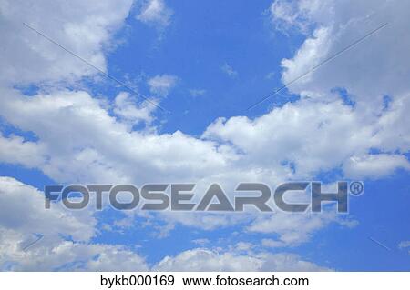 Blue sky with clouds View Large Photo Image Stock Photo - Blue sky with clouds. Fotosearch