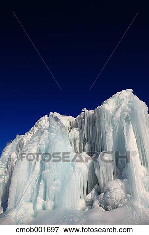 Icicles and dark sky View Large Photo Image Stock Photo - Icicles and dark sky. Fotosearch