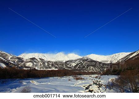 Mountains covered in snow and blue sky in Hakuba, Nagano Prefecture View Large Photo Image Picture - Mountains covered in snow and blue sky in Hakuba, Nagano Prefecture. Fotosearch