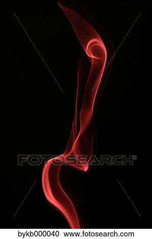 Stock Image - Red smoke on black background. Fotosearch