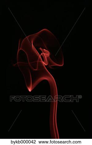 Stock Image - Red smoke on black background. Fotosearch