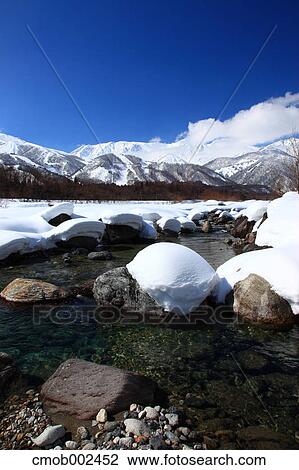 Stock Image - Snow and river in Hakuba, Nagano Prefecture. Fotosearch