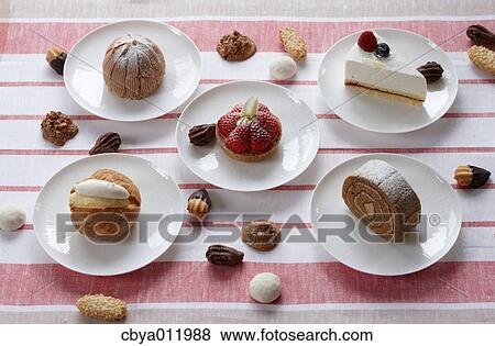 Stock Photo - Assorted cakes and pastry on a table. Fotosearch