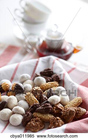 Assortment of pastry on a table View Large Photo Image Stock Photography - Assortment of pastry on a table. Fotosearch
