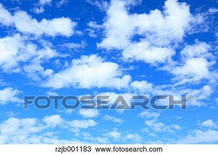 Blue sky with clouds View Large Photo Image Stock Image - Blue sky with clouds. Fotosearch
