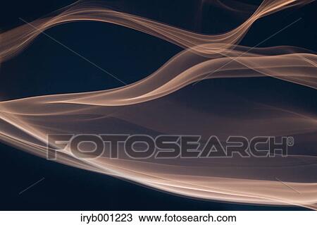 Stock Image - Brown smoke on black background. Fotosearch