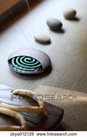 Clogs and mosquito coil View Large Photo Image Stock Photo - Clogs and mosquito coil. Fotosearch