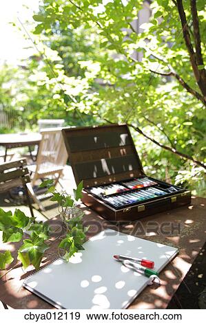 Stock Photo - Drawing tools and art supplies on a table. Fotosearch
