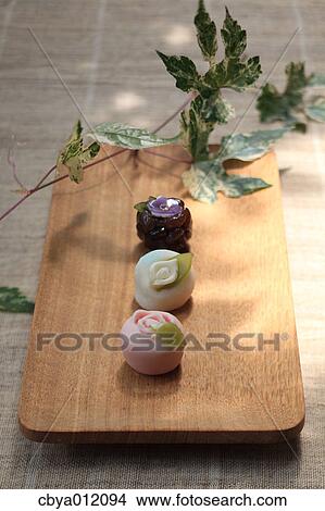Japanese confectionery on a wooden plate View Large Photo Image Picture - Japanese confectionery on a wooden plate. Fotosearch