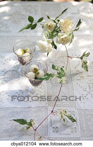 Picture - Japanese sweets and flowers on a table. Fotosearch