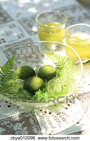 Japanese sweets and green tea on a table View Large Photo Image Stock Photograph - Japanese sweets and green tea on a table. Fotosearch