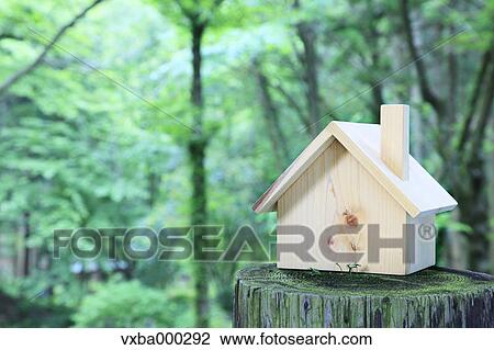 Miniature house on a log View Large Photo Image Stock Image - Miniature house on a log. Fotosearch