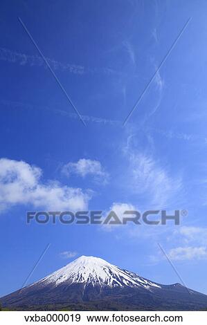 Stock Photo - Mount Fuji and blue sky with clouds. Fotosearch