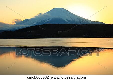 Stock Image - Mount Fuji and Lake Yamanaka, Yamanashi Prefecture. Fotosearch
