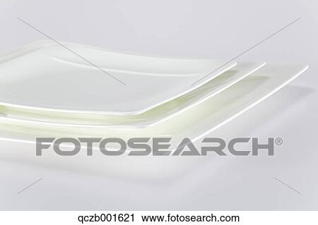 Stock Image - Piled white plates. Fotosearch