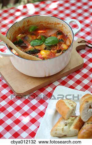 Stock Image - Ratatouille and bread on a table. Fotosearch