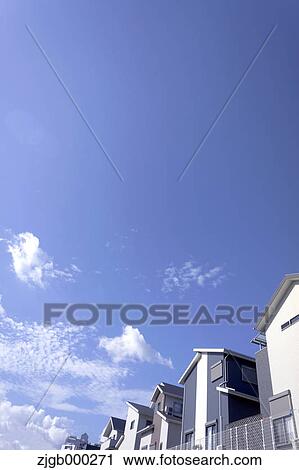 Residential area and blue sky with clouds View Large Photo Image Stock Image - Residential area and blue sky with clouds. Fotosearch