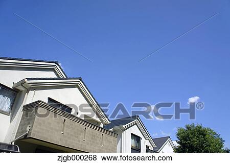 Residential area and blue sky with clouds View Large Photo Image Stock Photo - Residential area and blue sky with clouds. Fotosearch