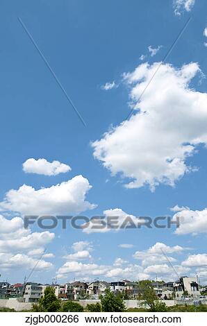 Residential area and blue sky with clouds View Large Photo Image Stock Photograph - Residential area and blue sky with clouds. Fotosearch